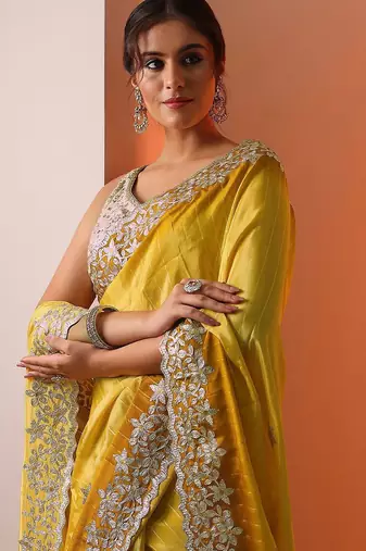 yellow embellished crepe saree with unstitched blouse piece