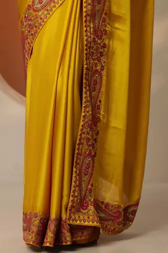 yellow solid chiffon saree with unstitched blouse piece