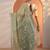 green embellished jimmy choo organza saree with unstitched blouse piece