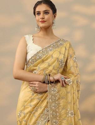 yellow embroidered organza saree with unstitched blouse piece 1