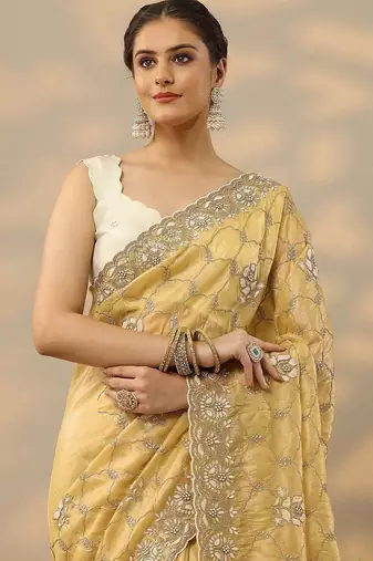 yellow embroidered organza saree with unstitched blouse piece