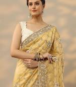 yellow embroidered organza saree with unstitched blouse piece