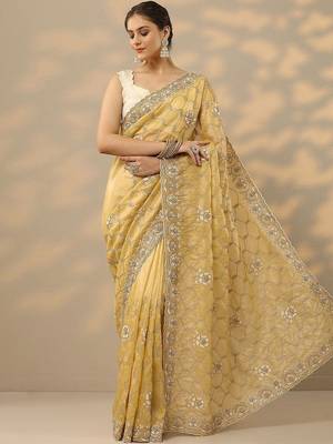 yellow embroidered organza saree with unstitched blouse piece 2