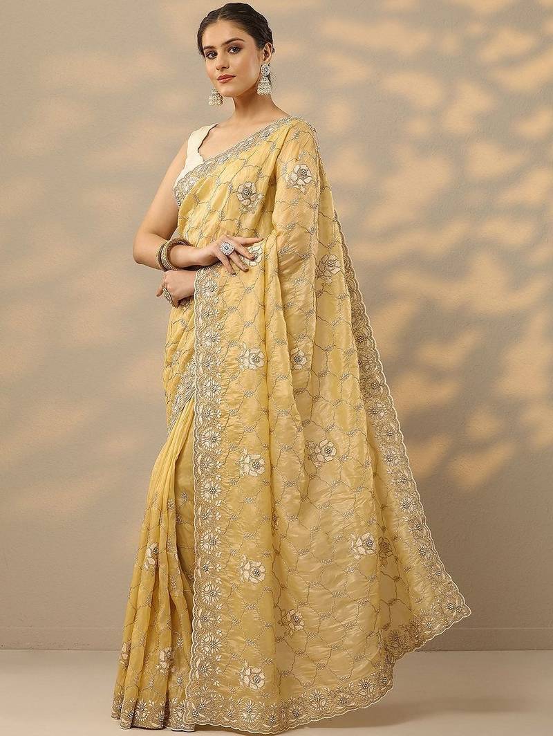 yellow embroidered organza saree with unstitched blouse piece