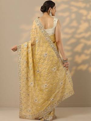 yellow embroidered organza saree with unstitched blouse piece 4