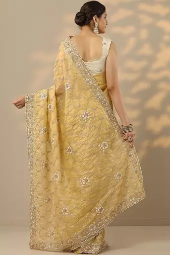 yellow embroidered organza saree with unstitched blouse piece