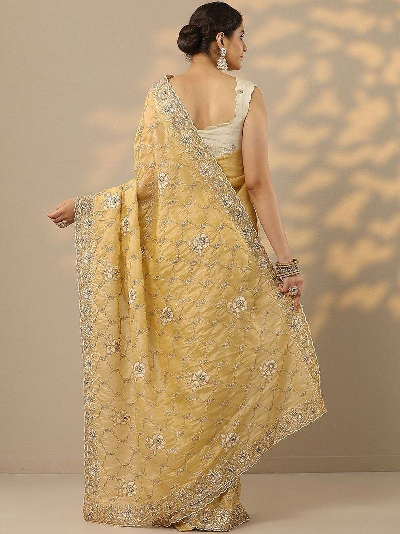 yellow embroidered organza saree with unstitched blouse piece