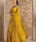 yellow embellished saree with unstitched blouse piece