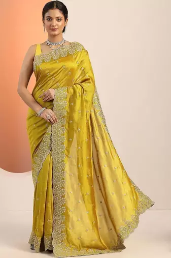 yellow embroidered saree with unstitched blouse piece