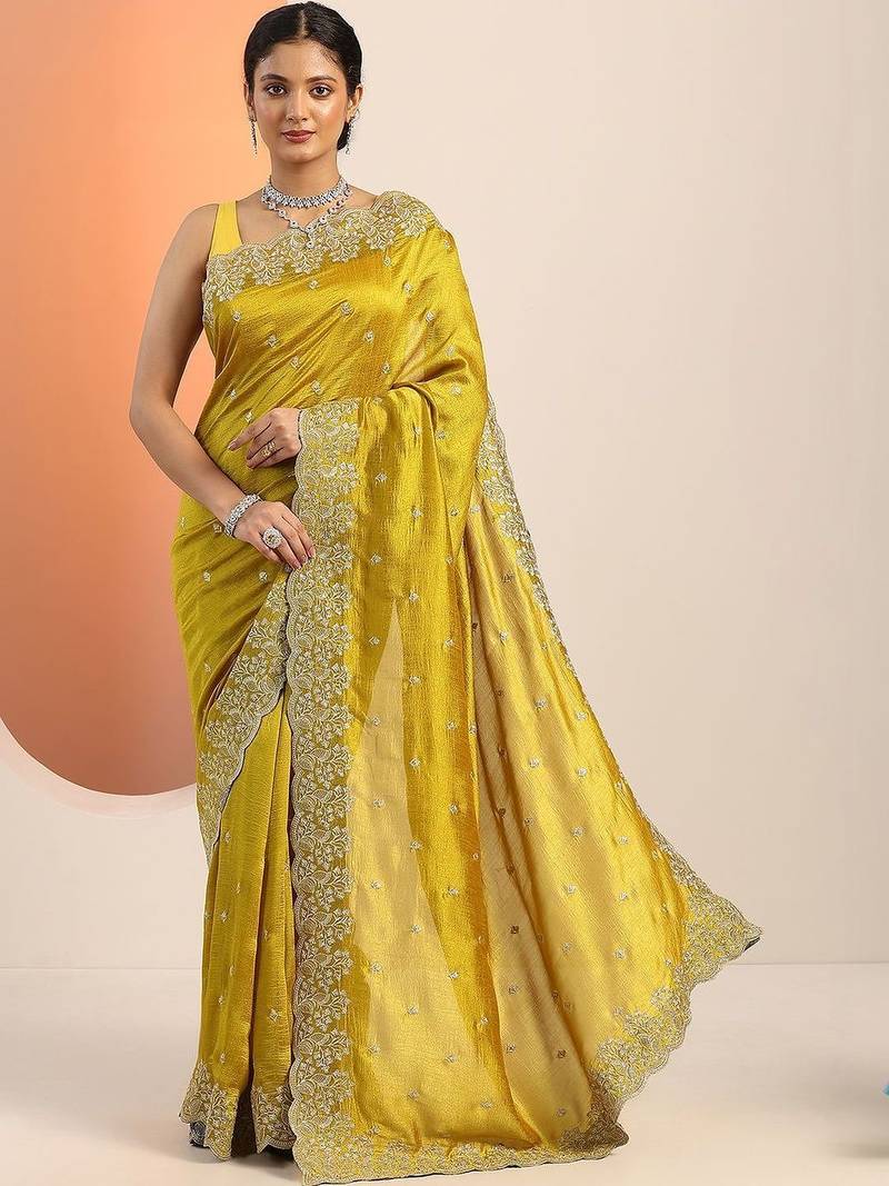 yellow embroidered saree with unstitched blouse piece
