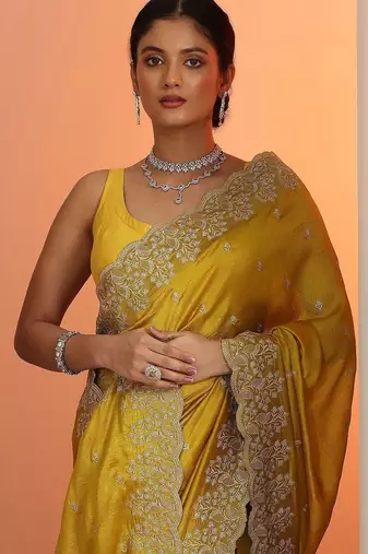 yellow embroidered saree with unstitched blouse piece