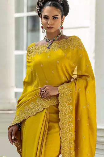 yellow embroidered saree with unstitched blouse piece