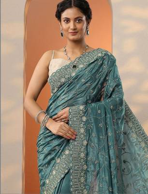 teal embroidered organza saree with unstitched blouse piece 2