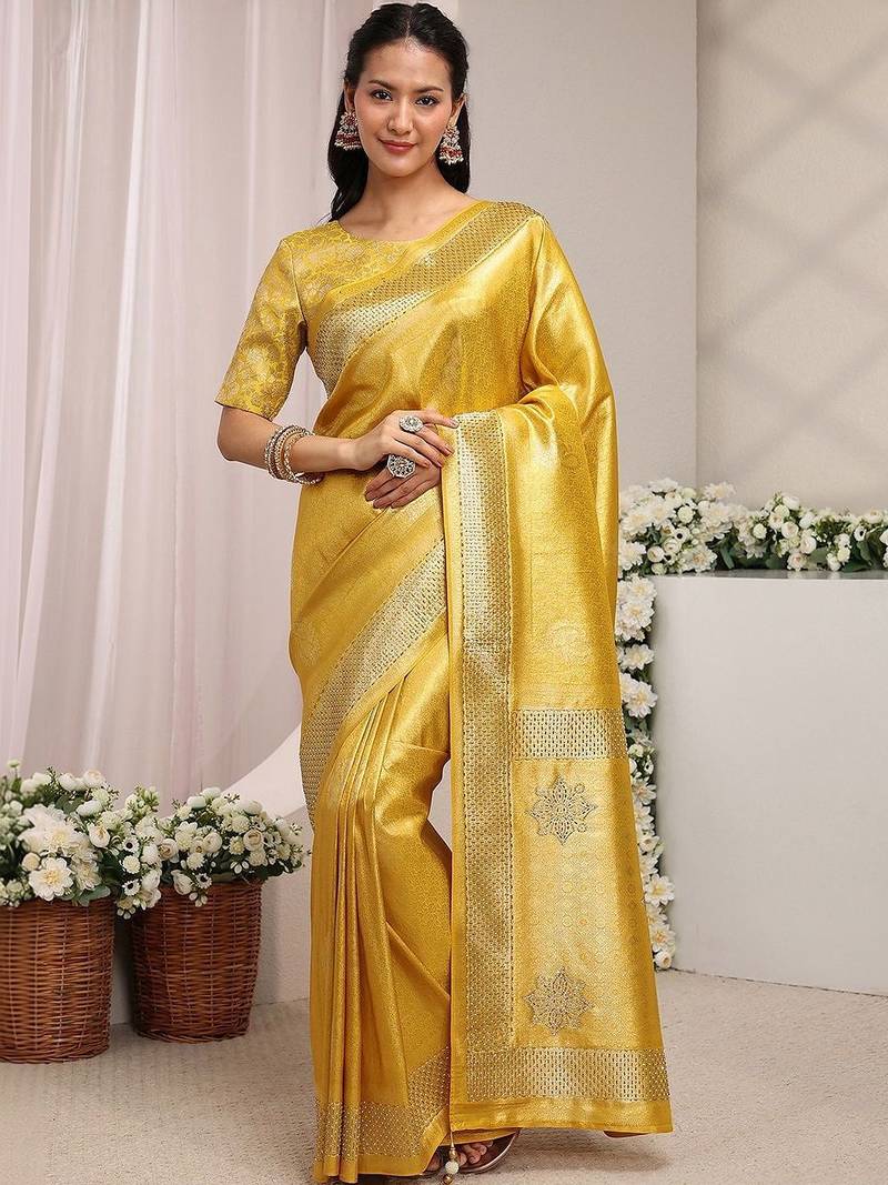 gold ethnic woven design saree with unstitched blouse piece