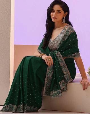 green stone work embelllished silk blend saree 1