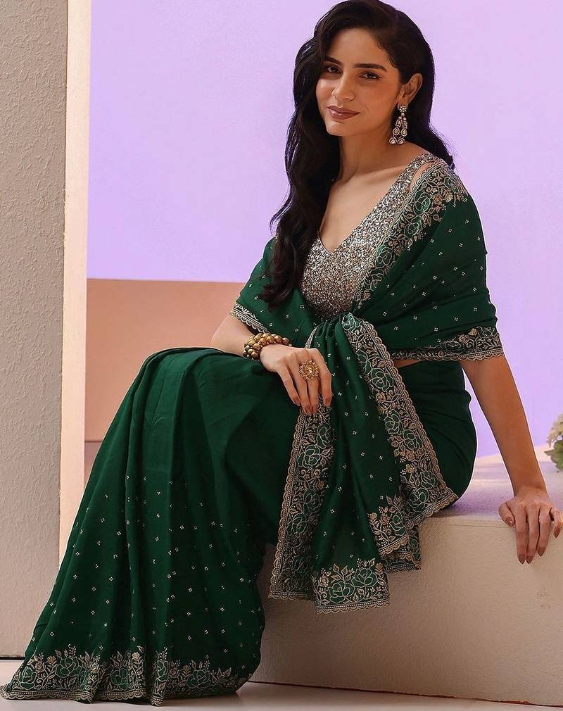 green stone work embelllished silk blend saree