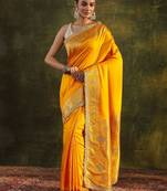 yellow ethnic saree with unstitched blouse piece