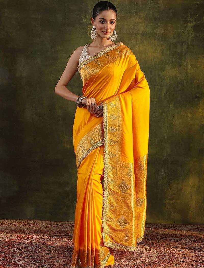 yellow ethnic saree with unstitched blouse piece