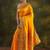 yellow ethnic saree with unstitched blouse piece