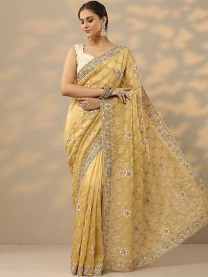yellow embroidered organza saree with unstitched blouse piece 1