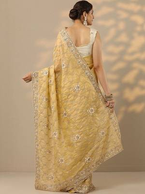 yellow embroidered organza saree with unstitched blouse piece 3