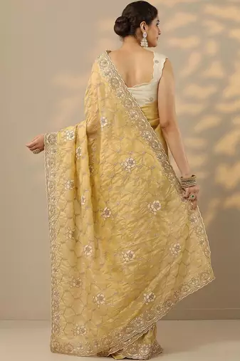 yellow embroidered organza saree with unstitched blouse piece