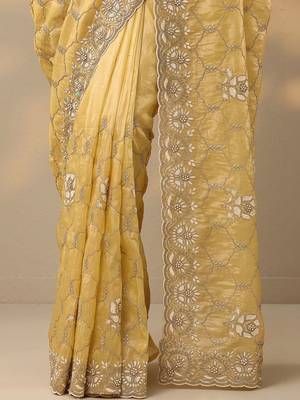 yellow embroidered organza saree with unstitched blouse piece 4
