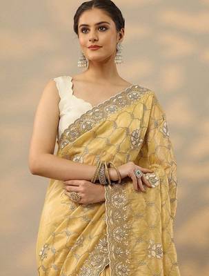 yellow embroidered organza saree with unstitched blouse piece 5