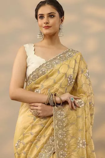 yellow embroidered organza saree with unstitched blouse piece