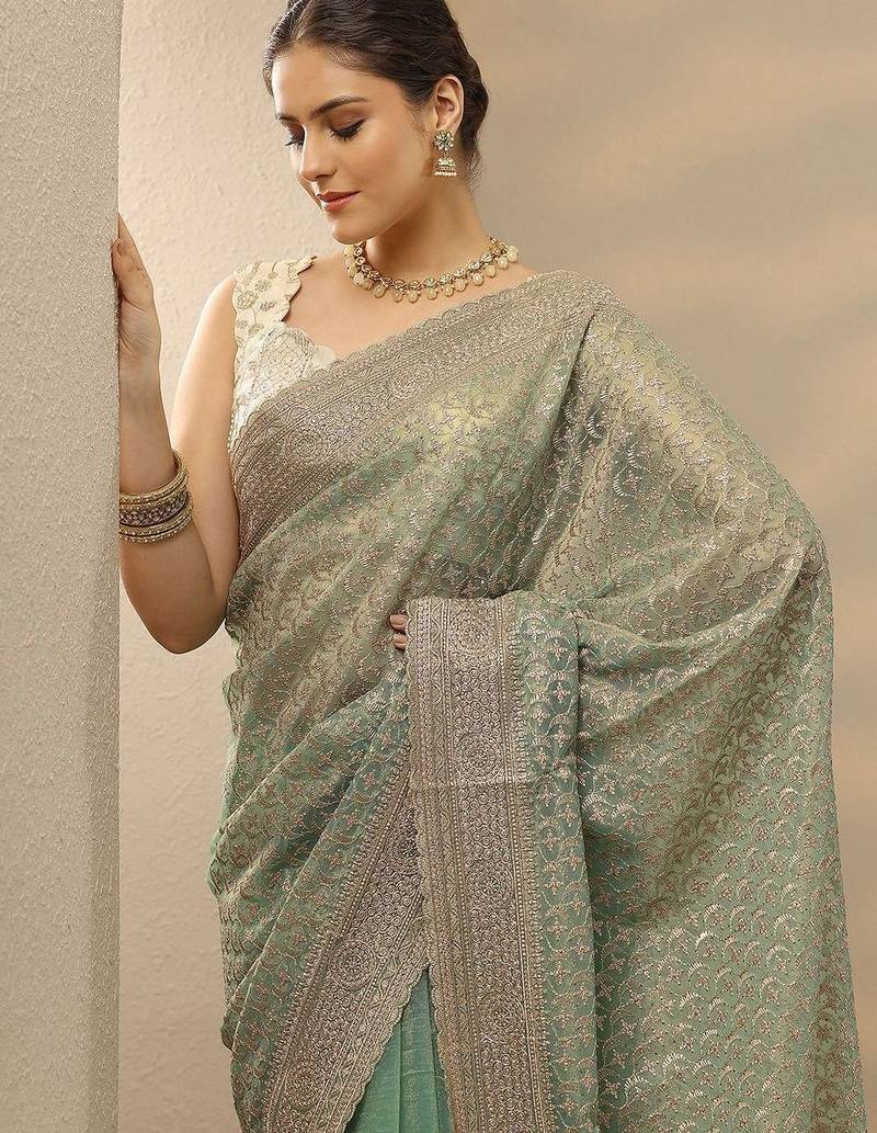 sea green embroidered nylon saree with unstitched blouse piece
