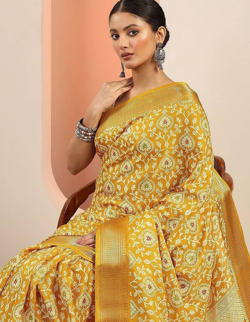 yellow printed saree with unstitched blouse piece