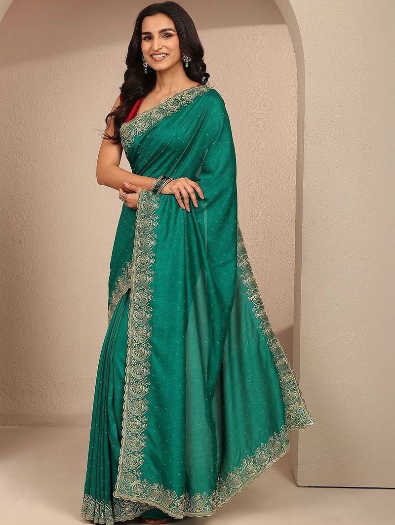 green embellished saree with unstitched blouse piece