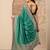 green embellished saree with unstitched blouse piece
