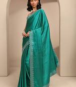 teal embellished saree with unstitched blouse piece