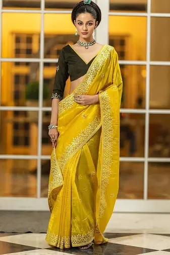 yellow embroidered organza saree with unstitched blouse piece