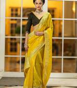 yellow embroidered organza saree with unstitched blouse piece