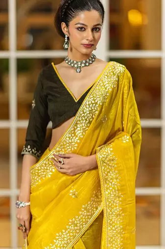 yellow embroidered organza saree with unstitched blouse piece
