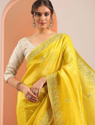 yellow embroidered organza saree with unstitched blouse piece 5