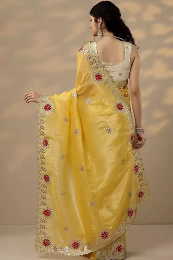 yellow embroidered organza saree with unstitched blouse piece
