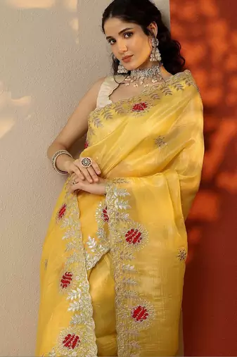 yellow embroidered organza saree with unstitched blouse piece