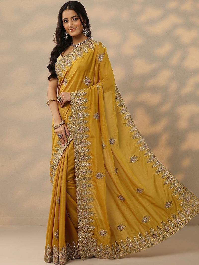 yellow embroidered saree with unstitched blouse piece