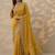 yellow embroidered saree with unstitched blouse piece