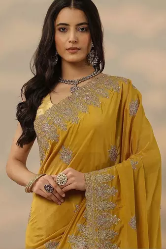 yellow embroidered saree with unstitched blouse piece