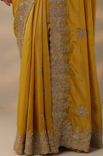 yellow embroidered saree with unstitched blouse piece