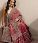 red embroidered saree with unstitched blouse piece