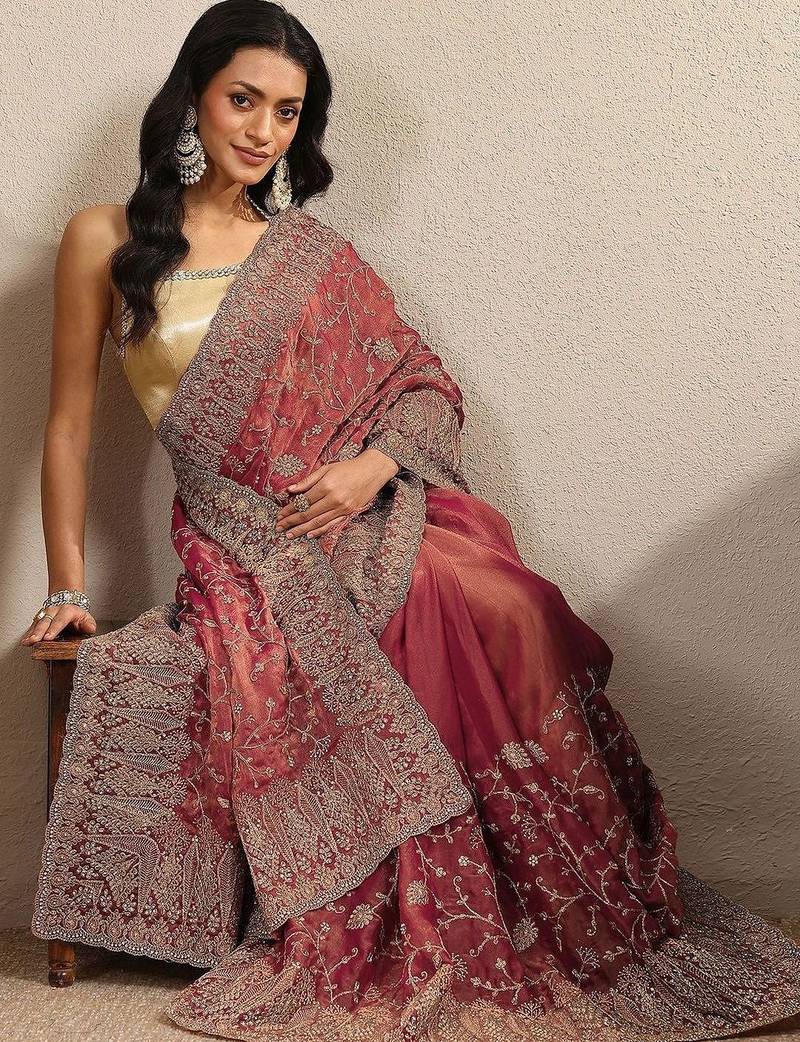 red embroidered saree with unstitched blouse piece