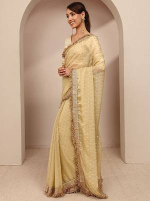 cream woven design tissue saree with unstitched blouse piece 2
