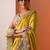 yellow embellished crepe saree with unstitched blouse piece