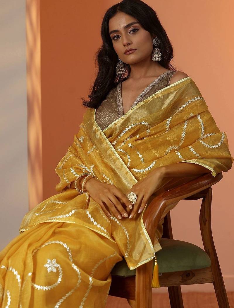 yellow embellished nylon saree with unstitched blouse piece