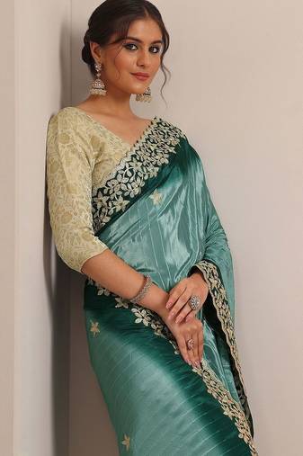 teal embellished crepe saree with unstitched blouse piece